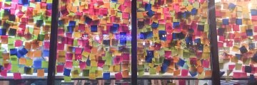 large-number-of-sticky-notes-on-cafe-glass