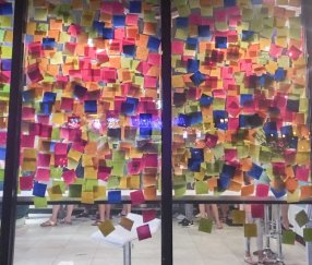 large-number-of-sticky-notes-on-cafe-glass